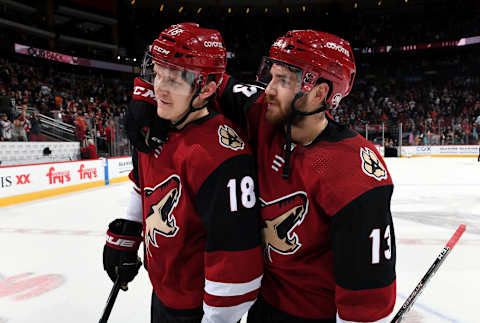 GLENDALE, ARIZONA – NOVEMBER 27: Christian Dvorak #18 of the Arizona Coyotes is congratulated by teammate Vinnie Hinostroza #13 following Dvorak’s game winning goal in a 4-3 shootout victory against the Anaheim Ducks during the NHL game at Gila River Arena on November 27, 2019 in Glendale, Arizona. (Photo by Norm Hall/NHLI via Getty Images)