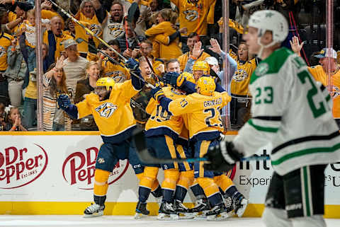 NASHVILLE, TN – APRIL 13: Craig Smith #15 celebrates his overtime goal with Rocco Grimaldi #23, Mattias Ekholm #14, Calle Jarnkrok #19 and P.K. Subban #76 of the Nashville Predators against the Dallas Stars in Game Two of the Western Conference First Round during the 2019 NHL Stanley Cup Playoffs at Bridgestone Arena on April 13, 2019 in Nashville, Tennessee. (Photo by John Russell/NHLI via Getty Images)