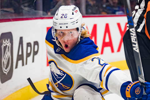 Mar 20, 2022; Vancouver, British Columbia, CAN; Buffalo Sabres defenseman Rasmus Dahlin (26) celebrates his game winning goal against the Vancouver Canucks at Rogers Arena. Sabres won 3-2 in overtime. Mandatory Credit: Bob Frid-USA TODAY Sports