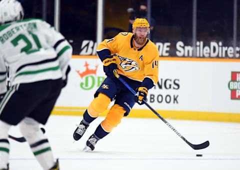 May 1, 2021; Nashville, Tennessee, USA; Nashville Predators defenseman Mattias Ekholm (14) skates with the puck during the first period against the Dallas Stars at Bridgestone Arena. Mandatory Credit: Christopher Hanewinckel-USA TODAY Sports