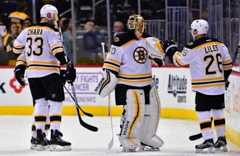 Nov 13, 2016; Denver, CO, USA; Boston Bruins defenseman John-Michael Liles (26) and goalie Tuukka Rask (40) and defenseman Zdeno Chara (33) celebrate the win over the Colorado Avalanche at Pepsi Center. The Bruins defeated the Avalanche 2-0. Mandatory Credit: Ron Chenoy-USA TODAY Sports