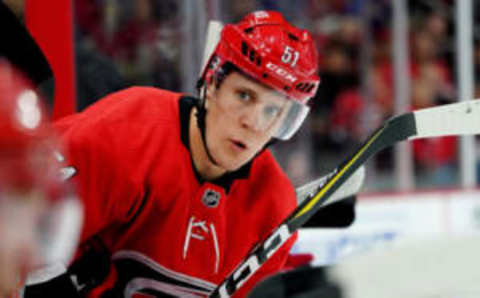 RALEIGH, NC – OCTOBER 6: Jake Gardiner #51 of the Carolina Hurricanes communicates with teammates in the bench area during an NHL game against the Tampa Bay Lightning on October 6, 2019 at PNC Arena in Raleigh North Carolina. (Photo by Gregg Forwerck/NHLI via Getty Images)