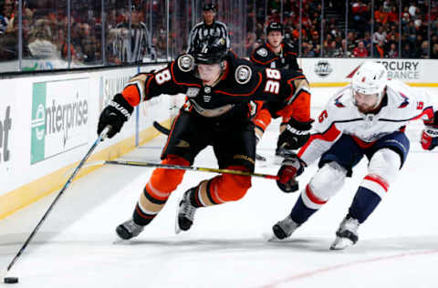 ANAHEIM, CA – FEBRUARY 17: Derek Grant #38 of the Anaheim Ducks controls the puck with pressure from Michal Kempny #6 of the Washington Capitals during the game on February 17, 2019, at Honda Center in Anaheim, California. (Photo by Debora Robinson/NHLI via Getty Images)