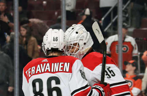 PHILADELPHIA, PA – APRIL 06: Teuvo Teravainen #86 and Curtis McElhinney #35 of the Carolina Hurricanes celebrate after defeating the Philadelphia Flyers 4-3 on April 6, 2019 at the Wells Fargo Center in Philadelphia, Pennsylvania. (Photo by Len Redkoles/NHLI via Getty Images)