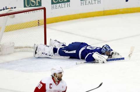 Dec 20, 2016; Tampa, FL, USA; Tampa Bay Lightning goalie Ben Bishop (30) falls to the ice after an apparent injury against the Detroit Red Wings during the first period at Amalie Arena. Mandatory Credit: Kim Klement-USA TODAY Sports