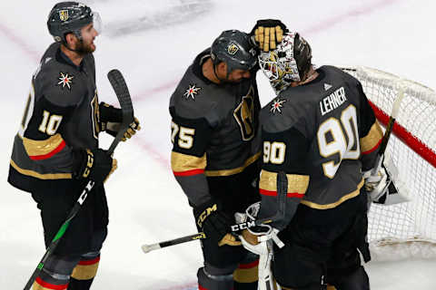 Robin Lehner #90 of the Vegas Golden Knights is congratulated by Ryan Reaves #75 after a win against the Chicago Blackhawks in Game One of the Western Conference First Round. (Photo by Jeff Vinnick/Getty Images)