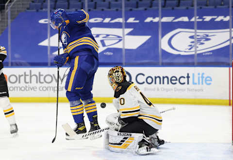 Apr 20, 2021; Buffalo, New York, USA; Buffalo Sabres defenseman Rasmus Ristolainen (55) jumps to avoid a shot on Boston Bruins goaltender Tuukka Rask (40) during the second period at KeyBank Center. Mandatory Credit: Timothy T. Ludwig-USA TODAY Sports