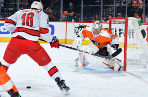 PHILADELPHIA, PA – MARCH 05: Carter Hart #79 of the Philadelphia Flyers looks to make a save on a shot by Vincent Trocheck #16 of the Carolina Hurricanes in the second period at Wells Fargo Center on March 5, 2020, in Philadelphia, Pennsylvania. (Photo by Drew Hallowell/Getty Images)