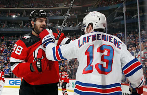 NEWARK, NEW JERSEY – APRIL 20: Kevin Bahl #88 of the New Jersey Devils and Alexis Lafreniere #13 of the New York Rangers exchange words during the third period during Game Two in the First Round of the 2023 Stanley Cup Playoffs at the Prudential Center on April 20, 2023, in Newark, New Jersey. (Photo by Bruce Bennett/Getty Images)