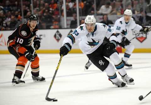 February 2, 2016; Anaheim, CA, USA; San Jose Sharks left wing Matt Nieto (83) moves the puck ahead of Anaheim Ducks right wing Corey Perry (10) during the first period at Honda Center. Mandatory Credit: Gary A. Vasquez-USA TODAY Sports