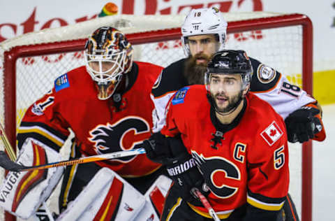 Apr 19, 2017; Calgary, Alberta, CAN; Calgary Flames defenseman Mark Giordano (5) and Anaheim Ducks right wing Patrick Eaves (18) fight for position in front of Calgary Flames goalie Chad Johnson (31) during the second period in game four of the first round of the 2017 Stanley Cup Playoffs at Scotiabank Saddledome. Mandatory Credit: Sergei Belski-USA TODAY Sports