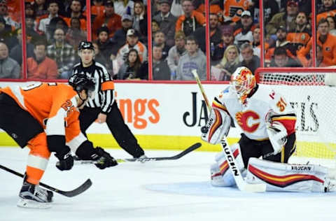 Nov 27, 2016; Philadelphia, PA, USA; Calgary Flames goalie Chad Johnson (31) makes a save against Philadelphia Flyers center Nick Cousins (25) during the second period at Wells Fargo Center. Mandatory Credit: Eric Hartline-USA TODAY Sports