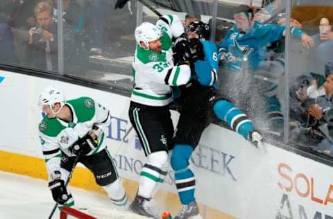 SAN JOSE, CA – APRIL 3: Melker Karlsson #68 of the San Jose Sharks takes a hard hit from Marc Methot #33 of the Dallas Stars at SAP Center on April 3, 2018 in San Jose, California. (Photo by Scott Dinn/NHLI via Getty Images)