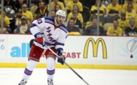 Apr 13, 2016; Pittsburgh, PA, USA; New York Rangers defenseman Keith Yandle (93) moves the puck against the Pittsburgh Penguins during the third period in game one of the first round of the 2016 Stanley Cup Playoffs at the CONSOL Energy Center. The Penguins won 5-2. Mandatory Credit: Charles LeClaire-USA TODAY Sports