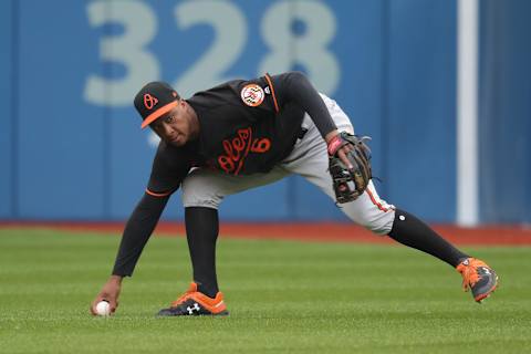 TORONTO, ON – JULY 20: Jonathan Schoop #6 of the Baltimore Orioles drops the ball but recovers to throw out the baserunner in the first inning during MLB game action against the Toronto Blue Jays at Rogers Centre on July 20, 2018 in Toronto, Canada. (Photo by Tom Szczerbowski/Getty Images)