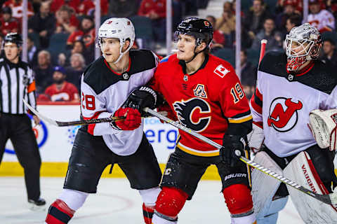 Calgary Flames left wing Matthew Tkachuk and New Jersey Devils defenseman Damon Severson (28): Sergei Belski-USA TODAY Sports