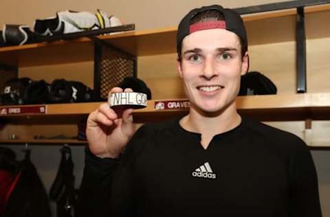 DENVER, CO – JANUARY 4: Ryan Graves #27 of the Colorado Avalanche holds the puck that was his first career NHL goal after the game against the New York Rangers at the Pepsi Center on January 4, 2019 in Denver, Colorado. The Avalanche defeated the Rangers 6-1. (Photo by Michael Martin/NHLI via Getty Images)