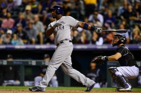 DENVER, CO – SEPTEMBER 30: Chris Carter #33 of the Milwaukee Brewers doubles against the Colorado Rockies during a game at Coors Field on September 30, 2016 in Denver, Colorado. (Photo by Dustin Bradford/Getty Images)