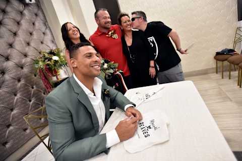 LAS VEGAS, NEVADA – SEPTEMBER 01: Ryan Reaves (L) of the Vegas Golden Knights poses after performing a renewal of vows ceremony for Laura Long (2nd L) and Justin Long (C) at Chapel of the Flowers on September 1, 2019 in Las Vegas, Nevada. The Long’s ceremony was the result of the couple winning a social media contest sponsored by the chapel. (Photo by David Becker/Getty Images)