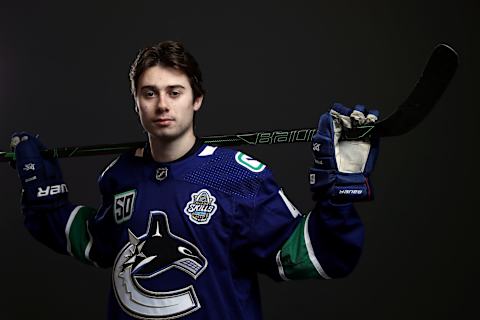 Quinn Hughes of the Vancouver Canucks poses for a picture at All-Star Weekend (Photo by Jamie Squire/Getty Images)