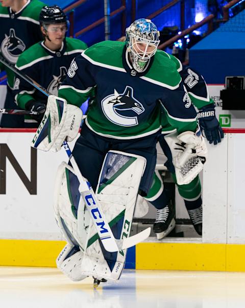 VANCOUVER, BC – FEBRUARY 19: Goalie Thatcher Demko #35 of the Vancouver Canucks wearing the team’s reverse retro jerseys leads the team out prior to NHL hockey action against the Winnipeg Jets at Rogers Arena on February 19, 2021 in Vancouver, Canada. (Photo by Rich Lam/Getty Images)