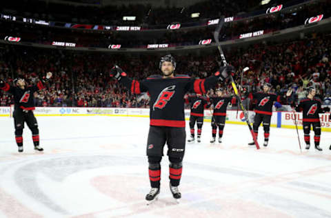 RALEIGH, NC – JANUARY 19: Justin Williams #14 of the Carolina Hurricanes leads the Storm Surge following a win in an NHL game against the New York Islanders on January 19, 2020 at PNC Arena in Raleigh, North Carolina. (Photo by Gregg Forwerck/NHLI via Getty Images)