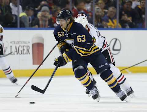 Dec 19, 2015; Buffalo, NY, USA; Buffalo Sabres left wing Tyler Ennis (63) brings the puck up ice during the second period against the Chicago Blackhawks at First Niagara Center. Mandatory Credit: Kevin Hoffman-USA TODAY Sports