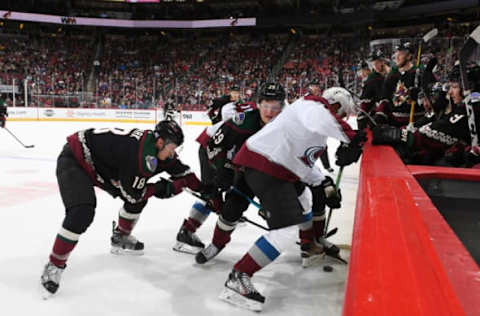 GLENDALE, ARIZONA – NOVEMBER 02: Barrett Hayton #29 and Christian Dvorak #18 of the Arizona Coyotes battle for the puck along the boards with Pierre-Eduard Bellemare #41 of the Colorado Avalanche at Gila River Arena on November 02, 2019 in Glendale, Arizona. (Photo by Norm Hall/NHLI via Getty Images)