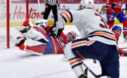 Apr 5, 2021; Montreal, Quebec, CAN; Montreal Canadiens goalie Carey Price (31) makes a sliding pad save against Edmonton Oilers forward Alex Chiasson (39) during the second period at the Bell Centre. Mandatory Credit: Eric Bolte-USA TODAY Sports