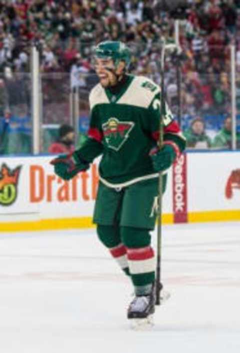 Feb 21, 2016; Minneapolis, MN, USA; Minnesota Wild defenseman Matt Dumba (24) celebrates following a Stadium Series hockey game against the Chicago Blackhawks at TCF Bank Stadium. The Wild defeated the Blackhawks 6-1. Mandatory Credit: Brace Hemmelgarn-USA TODAY Sports