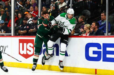 ST. PAUL, MN – SEPTEMBER 20: Minnesota Wild center Charlie Coyle (3), left, checks Dallas Stars defenseman Miro Heiskanen (4) along the boards during the preseason game between the Dallas Stars and the Minnesota Wild on September 20, 2018 at Xcel Energy Center in St. Paul, Minnesota. (Photo by David Berding/Icon Sportswire via Getty Images)