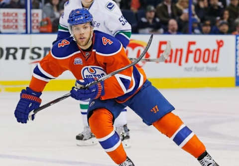 Mar 18, 2016; Edmonton, Alberta, CAN; Edmonton Oilers forward Taylor Hall (4) looks for a pass against the Vancouver Canucks at Rexall Place. Mandatory Credit: Perry Nelson-USA TODAY Sports