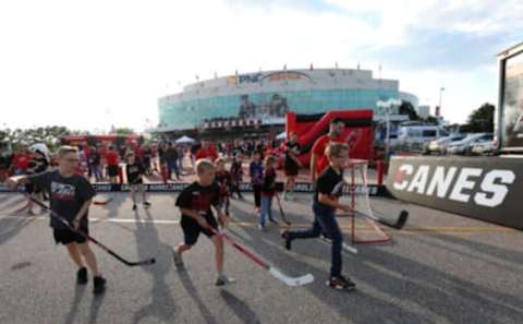 RALEIGH, NORTH CAROLINA – MAY 14: Carolina Hurricanes fans gather outside of the arena prior to Game Three between the Boston Bruins and the Carolina Hurricanes in the Eastern Conference Finals during the 2019 NHL Stanley Cup Playoffs at PNC Arena on May 14, 2019 in Raleigh, North Carolina. (Photo by Bruce Bennett/Getty Images)