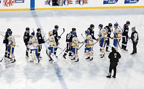 Mar 13, 2022; Hamilton, Ontario, Canada; Players from the Toronto Maple Leafs and the Buffalo Sabres shake hands after playing in the 2022 Heritage Classic ice hockey game at Tim Hortons Field. Mandatory Credit: Dan Hamilton-USA TODAY Sports