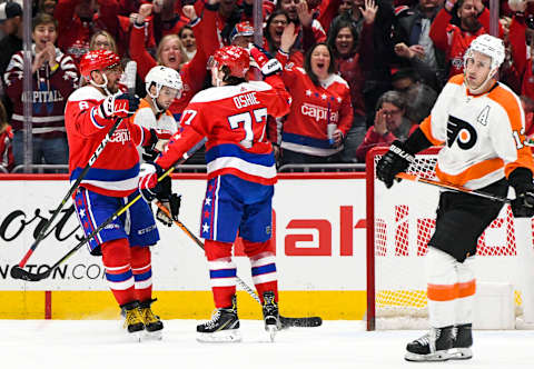 WASHINGTON, DC – FEBRUARY 08: Washington Capitals right wing T.J. Oshie (77) is congratulated by left wing Alex Ovechkin (8) after his goal in the first period against the Philadelphia Flyers on February 8, 2020 at the Capital One Arena in Washington, D.C. (Photo by Mark Goldman/Icon Sportswire via Getty Images)