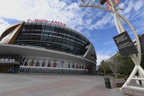 Messages on an LED video wall and a digital sign inform fans of the cancellation of the Pac-12 Conference men’s basketball tournament at T-Mobile Arena on March 12, 2020.