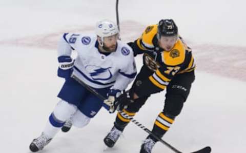 Aug 29, 2020; Toronto, Ontario, CAN; Tampa Bay Lightning forward Barclay Goodrow (19) and Boston Bruins defenseman Charlie McAvoy (73) skate during game four of the second round of the 2020 Stanley Cup Playoffs at Scotiabank Arena. Mandatory Credit: John E. Sokolowski-USA TODAY Sports