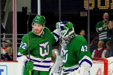 RALEIGH, NC – JANUARY 11: James Reimer #47 of the Carolina Hurricanes celebrates his shutout with teammates Brett Pesce #22 after defeating the Los Angeles Kings during an NHL game on January 11, 2020 at PNC Arena in Raleigh, North Carolina. (Photo by Gregg Forwerck/NHLI via Getty Images)