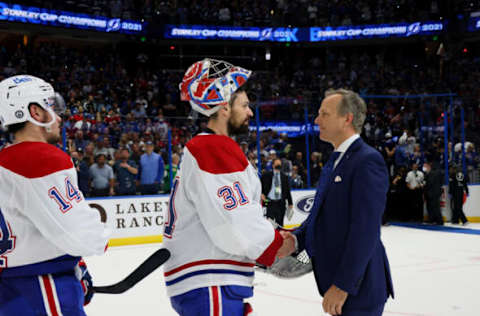 TAMPA, FLORIDA – JULY 07: Carey Price #31 of the Montreal Canadiens and head coach Jon Cooper of the Tampa Bay Lightning shake hands following the Lightning’s 1-0 victory in Game Five to win the 2021 NHL Stanley Cup Final at Amalie Arena on July 07, 2021 in Tampa, Florida. (Photo by Bruce Bennett/Getty Images)