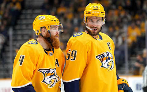 NASHVILLE, TN – OCTOBER 19: Roman Josi #59 and Ryan Ellis #4 of the Nashville Predators prepare for a face-off against the Florida Panthers at Bridgestone Arena on October 19, 2019 in Nashville, Tennessee. (Photo by John Russell/NHLI via Getty Images)