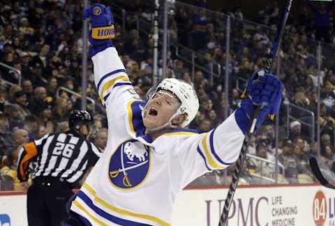 Dec 17, 2021; Pittsburgh, Pennsylvania, USA; Buffalo Sabres defenseman Rasmus Dahlin (26) reacts after scoring a goal against the Pittsburgh Penguins during the third period at PPG Paints Arena. The Penguins won 3-2 in overtime. Mandatory Credit: Charles LeClaire-USA TODAY Sports