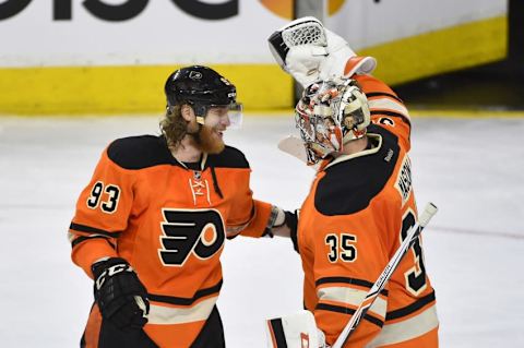 Apr 9, 2016; Philadelphia, PA, USA; Philadelphia Flyers left wing Jakub Voracek (93) celebrates with goalie Steve Mason (35) after a victory against the Pittsburgh Penguins at Wells Fargo Center. The Flyers won 3-1. Mandatory Credit: Derik Hamilton-USA TODAY Sports