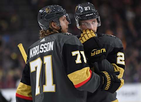 LAS VEGAS, NV – APRIL 04: William Karlsson #71 and Shea Theodore #27 of the Vegas Golden Knights talk during a stoppage in play during the first period against the Arizona Coyotes at T-Mobile Arena on April 4, 2019 in Las Vegas, Nevada. (Photo by Jeff Bottari/NHLI via Getty Images)