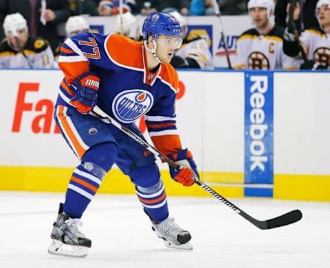 Dec 2, 2015; Edmonton, Alberta, CAN; Edmonton Oilers defensemen Oscar Klefbom (77) looks for the puck against the Boston Bruins at Rexall Place. Mandatory Credit: Perry Nelson-USA TODAY Sports