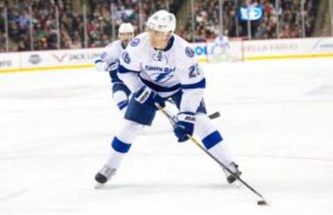 Nov 7, 2015; Saint Paul, MN, USA; Tampa Bay Lightning defenseman Matt Carle (25) shoots in the first period against the Minnesota Wild at Xcel Energy Center. Mandatory Credit: Brad Rempel-USA TODAY Sports