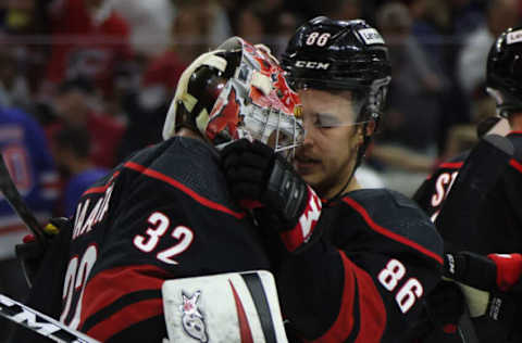 RALEIGH, NORTH CAROLINA – MAY 26: Antti Raanta #32 and Teuvo Teravainen #86 of the Carolina Hurricanes celebrate their 3-1 victory over the New York Rangers in Game Five of the Second Round of the 2022 Stanley Cup Playoffs at PNC Arena on May 26, 2022, in Raleigh, North Carolina. (Photo by Bruce Bennett/Getty Images)