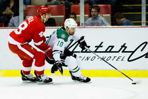 Nov 29, 2016; Detroit, MI, USA; Dallas Stars left wing Patrick Sharp (10) skates with the puck defended by Detroit Red Wings defenseman Ryan Sproul (48) in the first period at Joe Louis Arena. Mandatory Credit: Rick Osentoski-USA TODAY Sports