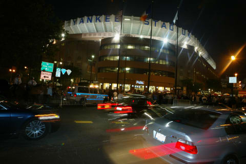 BRONX, NY – OCTOBER 8: Fans drive past Yankee Stadium before the start of game 1 of the American League Championship Series between the New York Yankee and Boston Red Sox on October 8, 2003 at Yankee Stadium in the Bronx, New York. (Photo by Al Bello/Getty Images)