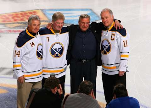 BUFFALO, NY – FEBRUARY 23: New Buffalo Sabres owner Terry Pegula stands with former Sabres palyers Rene Robert #14, Rick Martin #7 and Gilbert Perreault #11 during pre game ceremonies prior to play against the Atlanta Thrashers at HSBC Arena on February 23, 2011 in Buffalo, New York. (Photo by Rick Stewart/Getty Images)