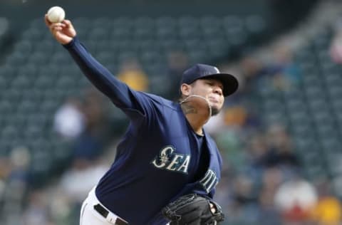 Oct 2, 2016; Seattle, WA, USA; Seattle Mariners starting pitcher Felix Hernandez (34) throws against the Oakland Athletics during the first inning at Safeco Field. Mandatory Credit: Jennifer Buchanan-USA TODAY Sports